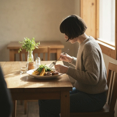 Person enjoying a farm-to-table meal at a cafe, featuring local ingredients